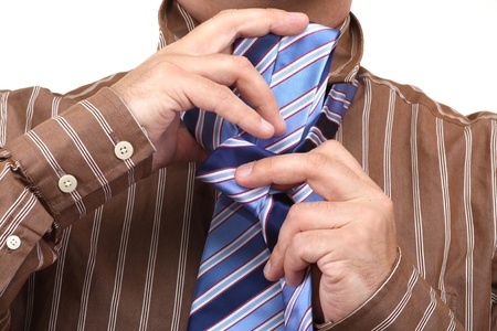 Tying a tieの写真素材