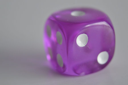 purple plastic arcylic d6 six sided die dice close up variable focus