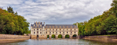 chenonceau castle from the river with a cloudy skyのeditorial素材