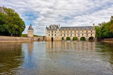 Chenonceau castle from the river under a cloudy skyのeditorial素材
