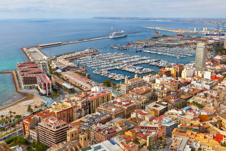Aerial view of the port and coastline in Alicante, Spain with moored yachts, pleasure boats and larger shipping moored in the harbourのeditorial素材