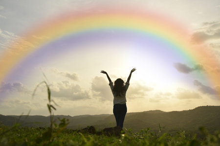 Traveller young girl enjoying and watching rainbow with sun set . adventure trip India....
