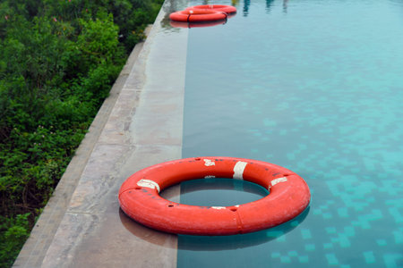 Beautiful blue fresh infinity swimming pool in a forest villa