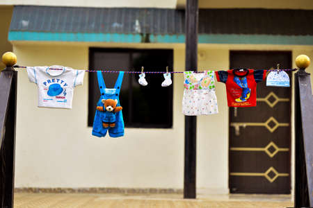Baby clothes hanging on the clothesline. Outdoor concept .の写真素材