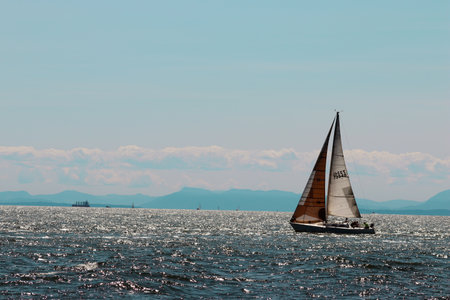 Sailboat against Vancouver backdrop. vancouver fun .のeditorial素材