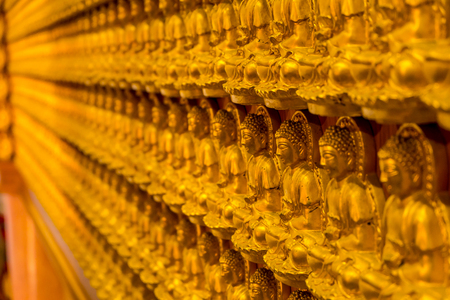 Pattern of golden wood carving buddha sculpture on chinese temple wallの写真素材