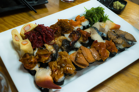 Sushi set serving on wooden table with wasabiの写真素材
