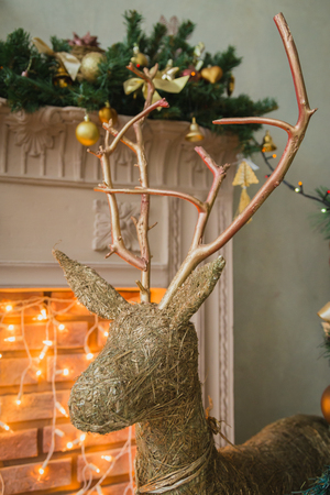Hand made Cristmas deer near fireplace, FULL SIZEの写真素材