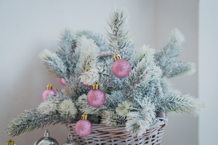 Christmas tree branch with ball and toysの写真素材
