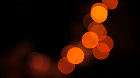 Christmas and new year background. Elegant abstract garlands with bokeh lights in the dark roomの写真素材