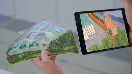 NIZHNIY NOVGOROD, RUSSIA - JANUARY 28, 2017: Exhibition of modern technologies. Tablet augmented reality app. Future and technology conceptのeditorial素材