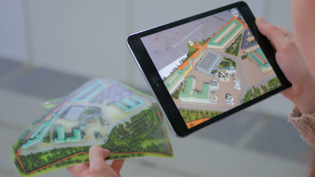 NIZHNIY NOVGOROD, RUSSIA - JANUARY 28, 2017: Exhibition of modern technologies. Tablet augmented...