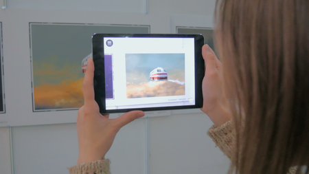 NIZHNIY NOVGOROD, RUSSIA - JANUARY 28, 2017: Exhibition of modern technologies. Tablet augmented...