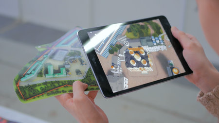 NIZHNIY NOVGOROD, RUSSIA - JANUARY 28, 2017: Exhibition of modern technologies. Tablet augmented...
