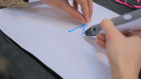 Close up shot. Woman using 3D printing pen. Future and technology conceptの写真素材