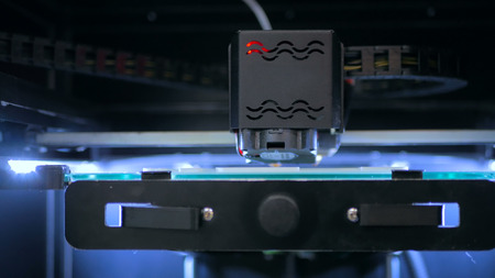 Three dimensional printing machine. 3D printer during workの写真素材