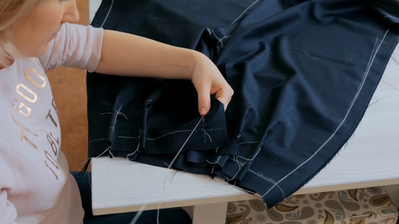 Professional tailor, fashion designer working at sewing studio. Preparation process. Fashion and tailoring conceptの写真素材