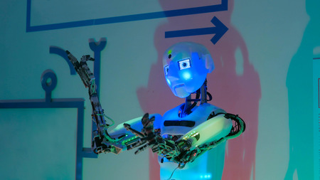 Portrait of funny humanoid robot at technology exhibition. Future and robotic conceptのeditorial素材