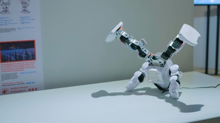 MOSCOW, RUSSIA - July 30, 2018: Robostation - future exhibition. Humanoid robot dancing at technology exhibition. Future and robotic conceptのeditorial素材