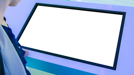 Woman using white empty interactive touchscreen display at modern technology exhibition - close up...