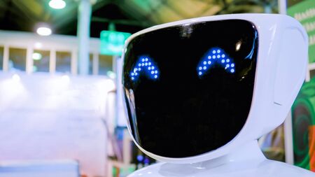 MOSCOW, RUSSIA - OCTOBER 12, 2018: 3D Print Expo - white robot with blue eyes at technology exhibition. Future, kawaii and robotic conceptのeditorial素材