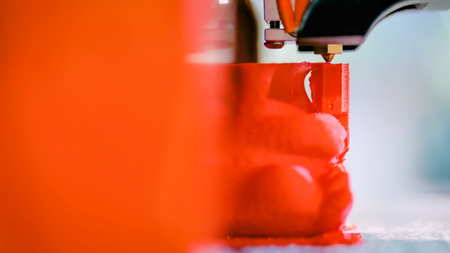 Automatic three dimensional 3D printer machine printing plastic model at modern technology exhibition. 3D printing, additive technologies, 4.0 industrial revolution and futuristic conceptの写真素材