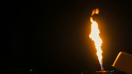 Fire from gas jet burner. Flame jet, streams of flame at nightの写真素材