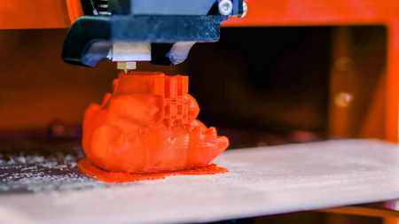 Automatic three dimensional 3D printer machine printing plastic model at modern technology exhibition. 3D printing, additive technologies, 4.0 industrial revolution and futuristic conceptの写真素材
