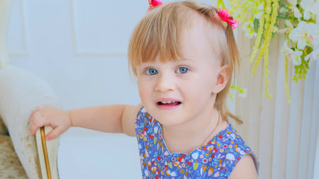 Portrait of funny little girl at home. Family, childhood and leisure concept. Close up shot of baby...