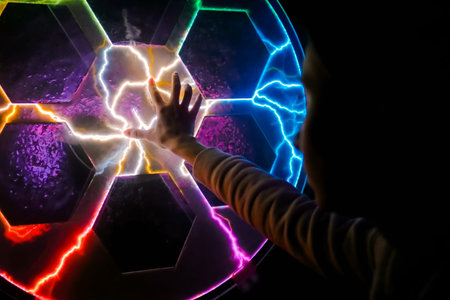 Woman hand touching plasma panel display. Interactive touchscreen exposition in science museum....