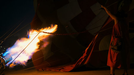 Close up shot - fire from gas jet burner in hot air balloon at nightの写真素材