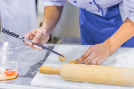Professional cooking, catering, culinary, gastronomy and food concept. Baker, chef hands preparing...