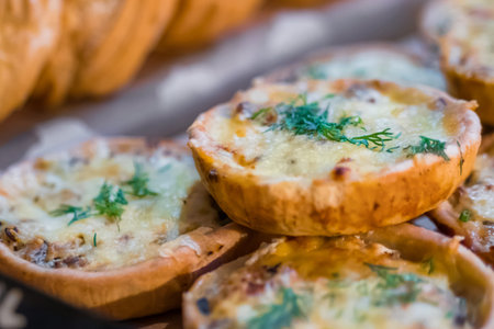 Assortment of delicious freshly baked tart pies with cheese, meat, mushroom and dill for sale on...