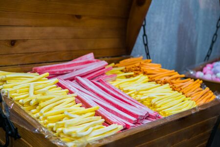 Assortment of colorful delicious marmalade jelly candies for sale on counter of shop, grocery, market, cafe. Dessert, sweet food and confectionery conceptの写真素材