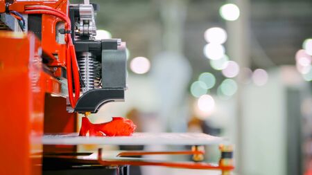 Automatic three dimensional 3D printer machine printing plastic model at modern technology exhibition. 3D printing, additive technologies, 4.0 industrial revolution and futuristic conceptの写真素材
