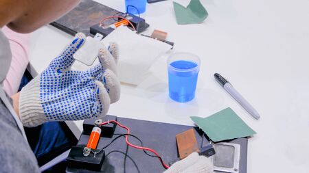 Assembly of electronic mechanical device. Manufacturing, engineering and educational conceptの写真素材