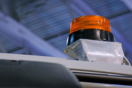 Close up of warning orange beacon flashing on roof of emergency, support and service vehicle....