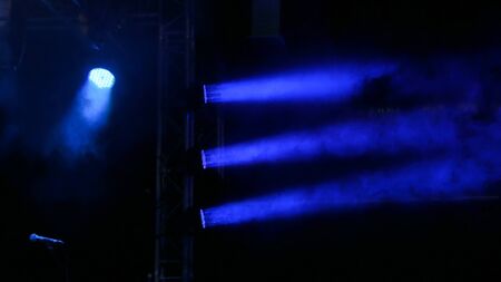 Before concert: dark blue lighting on stageの写真素材