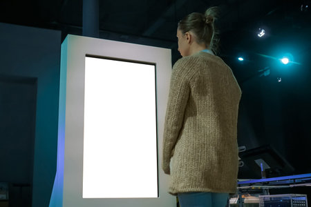 White screen, mockup, science, copyspace, template, isolated, technology concept. Woman looking at...