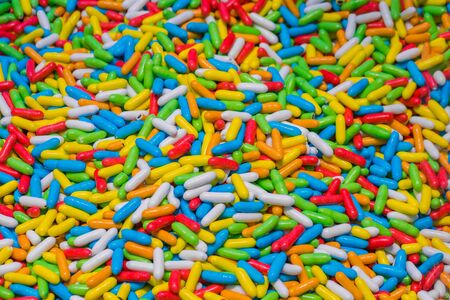 Colorful delicious glazed chocolate candies background, copy space, pattern. Dessert, sweet food and confectionery conceptの写真素材