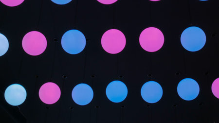 Ceiling moving led ball of two colors - blue and pink. Modern decor concept
