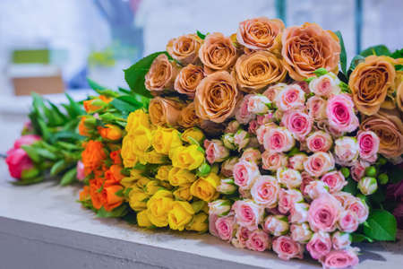 Colorful beautiful flowers bouquet - roses at studio, flower shop - close up view. Floristry, romantic, holiday, birthday, valentine day, wedding, celebration conceptの写真素材