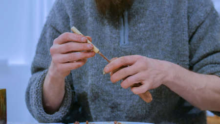 Professional male potter making ceramic tobacco pipe in pottery workshop, studio. Close up shot of man hands. Handmade, art and handicraft conceptの写真素材