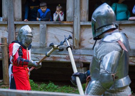 NIZHNIY NOVGOROD, RUSSIA - JUNE 2018: Volga Shtandart Historic Festival. Two militant medieval knights fighting at historical festival. Fantasy, reenactment and medieval culture conceptのeditorial素材