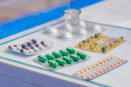 Medical capsules, pills, tablets, drugs, meds in blister pack for sale at pharmacy drug store, pharmaceutical exhibition. Pharma industry, medicine and healthcare conceptの写真素材