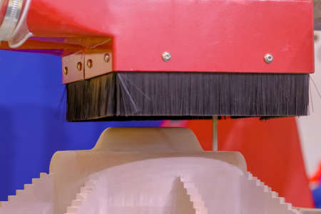 Automated milling machine cutting wooden workpiece from wood pulp, making 3d model at technology exhibition, factory - close up. Woodworking, CNC engraving, carving, industrial, manufacturing conceptの写真素材