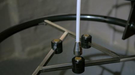 Interactive exposition in science museum - magnetic pendulum moves between three magnets. Science,...