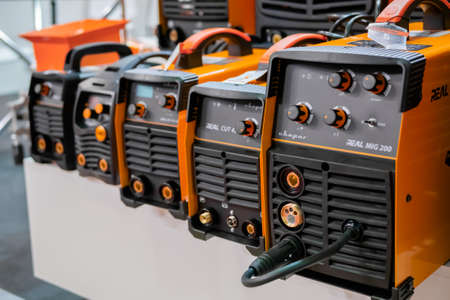 MOSCOW, RUSSIA - JANUARY 5, 2020: Metalworking Exhibition. Row of inverter welding machines on table at exhibition, trade show - close up. Industry, equipment, technology conceptのeditorial素材