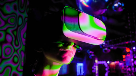 Woman using virtual reality headset, looking around at interactive technology exhibition with...