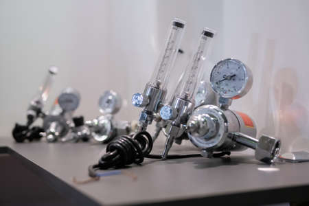 MOSCOW, RUSSIA - JANUARY 5, 2020: Metalworking Exhibition. Gas flowrate regulators and flow measuring units on table - close up. Manufacturing, measuring, industrial, engineering, technology conceptのeditorial素材
